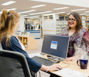 An RPL staff member helps a happy customer.