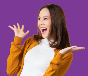 A woman with her hands up as she is pleasently surprised to hear that the library has 3D printing services.