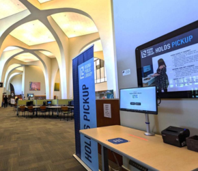 The holds pick up table at the University of Regina Archer Library.