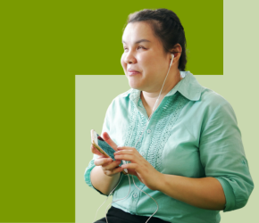 A blind woman navigates her surroundings using her mobile phone.