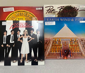 A photo of records by Earth Wind and Fire, Blondie, and Pat Benatar